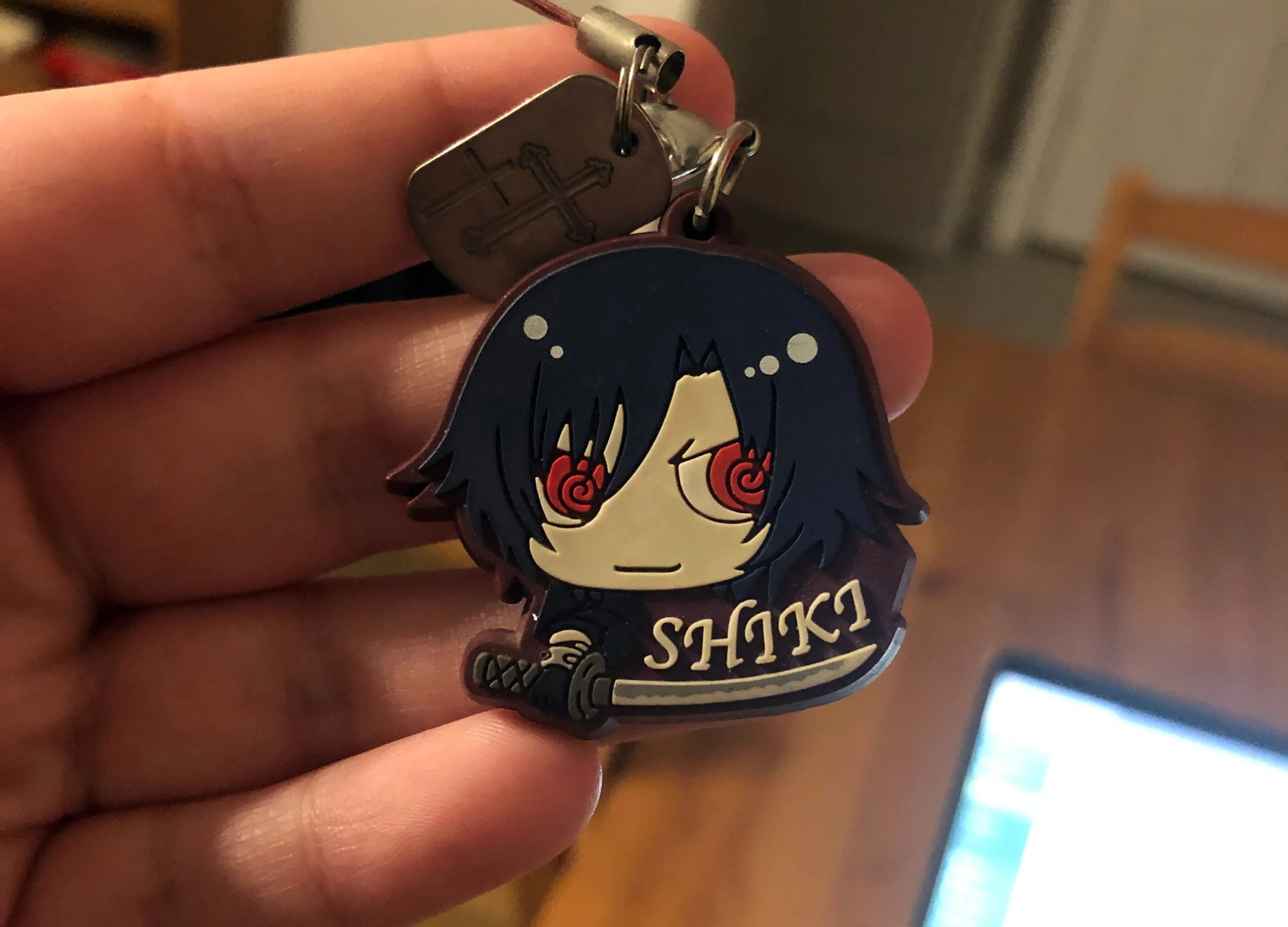 Shiki phone charm purchased from an anime convention dealers' room.